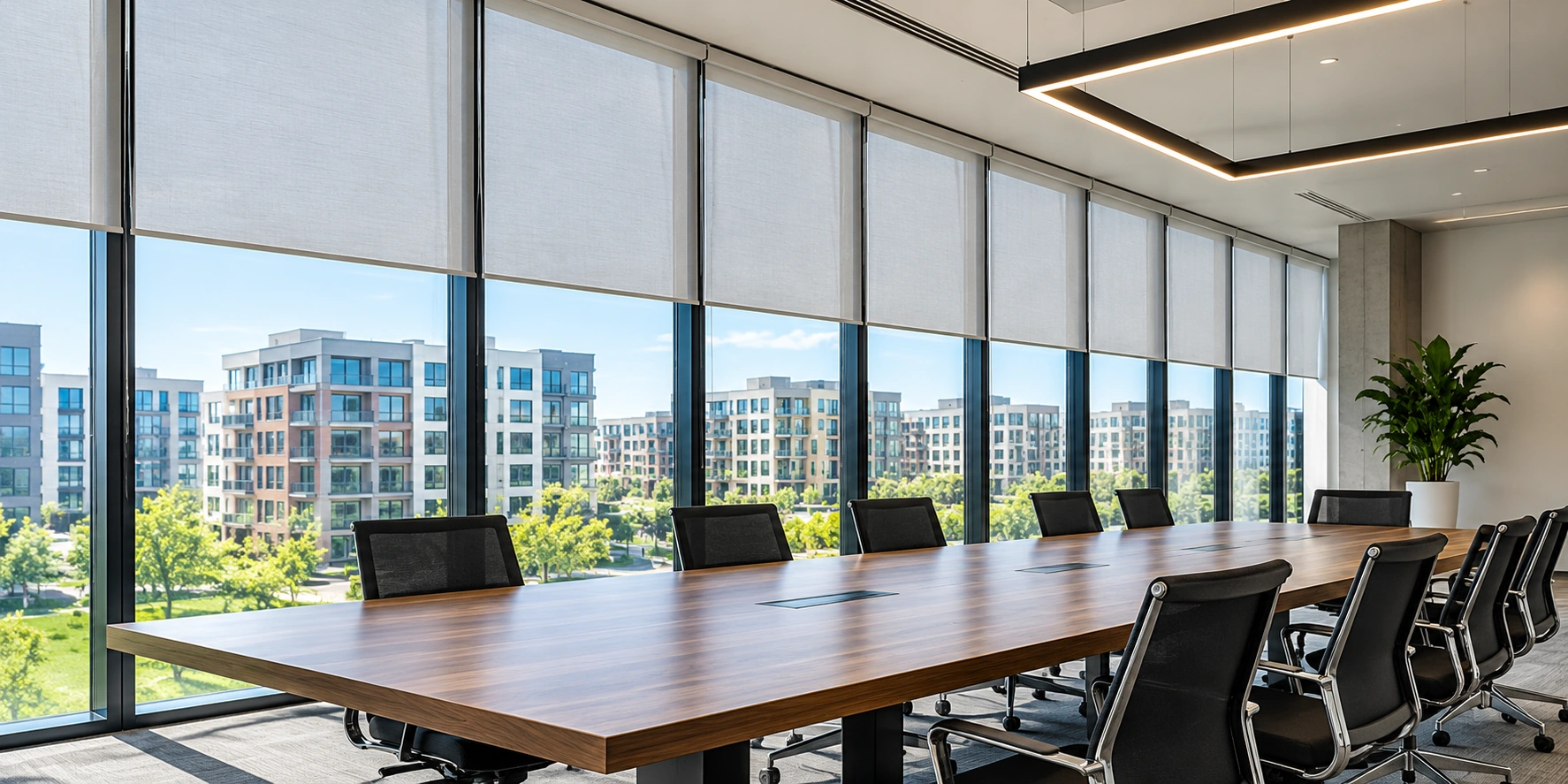 Commercial meeting room with matching roller shades
